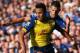 LIVERPOOL, ENGLAND - AUGUST 23: Alexis Sanchez of Arsenal under pressure from Kevin Mirallas of Everton during the Barclays Premier League match between Everton and Arsenal at Goodison Park on August 23, 2014 in Liverpool, England. (Photo by Clive Brunskill/Getty Images)