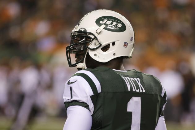 New York Jets quarterback Michael Vick stands on the sidleines during an NFL preseason football game against the Cincinnati Bengals, Saturday, Aug. 16, 2014, in Cincinnati. (AP Photo/Tom Uhlman)