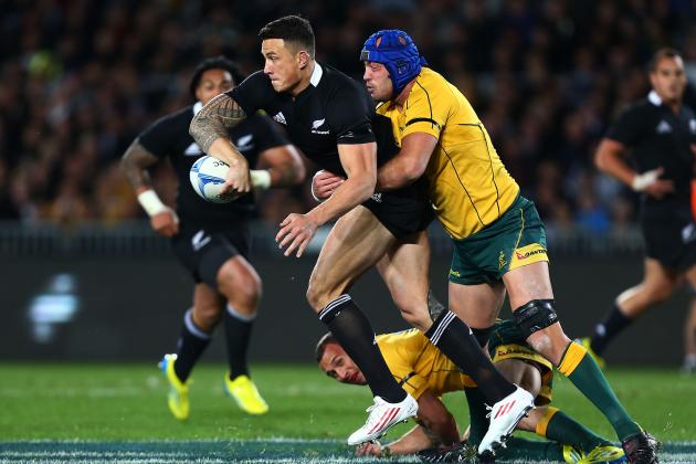 AUCKLAND, NEW ZEALAND - AUGUST 25: Sonny Bill Williams of the All Blacks looks to offload the ball in the tackle of Nathan Sharpe of the Wallabies during The Rugby Championship Bledisloe Cup match between the New Zealand All Blacks and the Australian Wallabies at Eden Park on August 25, 2012 in Auckland, New Zealand. (Photo by Simon Watts/Getty Images)