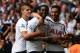LONDON, ENGLAND - AUGUST 24: Emmanuel Adebayor of Spurs celebrates his goal with team mates during the Barclays Premier League match between Tottenham Hotspur and Queens Park Rangers at White Hart Lane on August 24, 2014 in London, England. (Photo by Jamie McDonald/Getty Images)