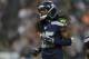 Seattle Seahawks cornerback Richard Sherman runs on the field in the first half of a preseason NFL football game against the Chicago Bears, Friday, Aug. 22, 2014, in Seattle. (AP Photo/John Froschauer)