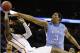 Iowa State guard DeAndre Kane (50) tries to shoot as North Carolina forward Kennedy Meeks (3) defends during the second half of a third-round game in the NCAA college basketball tournament Sunday, March 23, 2014, in San Antonio. (AP Photo/David J. Phillip)