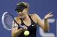 Maria Sharapova, of Russia, returns a shot to Maria Kirilenko, of Russia, during the opening round of the U.S. Open tennis tournament Monday, Aug. 25, 2014, in New York. (AP Photo/Darron Cummings)