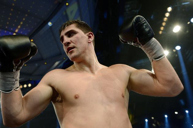 Champion Marco Huck of Germany celebrates after defending his WBO cruiserweight title against challenger Firat Arslan in Stuttgart, Germany, Saturday, Jan. 25, 2014. Huck stopped compatriot Arslan in the sixth round of their rematch to successfully retain his WBO belt for the 12th time. (AP Photo/Daniel Kopatsch)