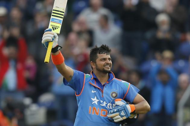 India's Suresh Raina celebrates getting 100 runs not out, during their One Day International cricket match against England at the SWALEC cricket ground in Cardiff, Wales, Wednesday, Aug. 27, 2014. (AP Photo/Alastair Grant)