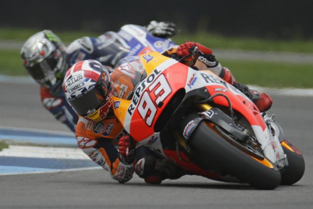Marc Marquez, of Spain, leads Jorge Lorenzo, of Spain, on his way to winning the Indianapolis Moto GP motorcycle race at the Indianapolis Motor Speedway in Indianapolis, Sunday, Aug. 10, 2014.  (AP Photo/Michael Conroy)