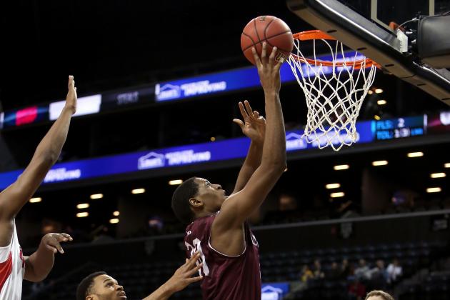 NEW YORK, NY - MARCH 13: Ryan Rhoomes #30 of the Fordham Rams drives to the basket against Vee Sanford #43 of the Dayton Flyers in the second half in the Second Round of the 2014 Atlantic 10 Men's Basketball Tournament at Barclays Center on March 13, 2014 in the Brooklyn Borough of New York City. (Photo by Mike Lawrie/Getty Images)