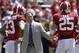 Alabama coach Nick Saban reacts to a breakdown with defensive players Alabama defensive back Jabriel Washington (23) and linebacker Dillon Lee (25) during Alabama's A-Day NCAA college football spring game Saturday, April 19, 2014, in Tuscaloosa, Ala. (AP Photo/Butch Dill)