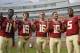 Florida State quarterbacks John Franklin III (11), Troy Cook (19), J. J. Cosentino (16), Sean Maguire (10) and Jameis Winston (5) make a Boy Scout sign as they pose for a photo during their NCAA college football media day on Sunday, Aug. 10, 2014, in Tallahassee, Fla. (AP Photo/Phil Sears)