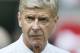 Arsenal's manger Arsene Wenger watches his players wait to go up and collect the trophy after defeating Manchester City 3-0, during the English FA Community Shield soccer match at Wembley Stadium, London Sunday, Aug. 10, 2014. (AP Photo/Alastair Grant)