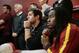 Southern California quarterback Cody Kessler, center, and safety Josh Shaw, right, listen to their new football head coach Steve Sarkisian during a news conference on Tuesday, Dec. 3, 2013, in Los Angeles. USC hired Sarkisian away from Washington on Monday, bringing back the former Trojans offensive coordinator to his native Los Angeles area and the storied program where he thrived as Pete Carroll's assistant. (AP Photo/Jae C. Hong)