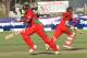 Zimbabwean batsman Hamilton Masakadza, left, makes a run on the first cricket ODI against Australia at Harare Sports Club in Harare Zimbabwe Monday, Aug. 25, 2014. The Australian is in Zimbabwe for a triangular ODI series with Zimbabwe and South Africa. (AP Photo/Tsvangirayi Mukwazhi)