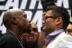 Jul 14, 2014; New York, NY, USA; Floyd Mayweather Jr. and Marcos Maidana (right) stare at each other during face off to promote their upcoming welterweight rematch during a press conf at Times Square. Mandatory Credit: Noah K. Murray-USA TODAY Sports