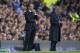 Everton's manager Roberto Martinez, left, stands alongside Chelsea's manager Jose Mourinho during their English Premier League soccer match at Goodison Park Stadium, Liverpool, England, Saturday Aug. 30, 2014. (AP Photo/Jon Super)