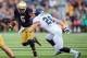 Aug 30, 2014; South Bend, IN, USA; Notre Dame Fighting Irish quarterback Everett Golson (5) runs the ball as Rice Owls linebacker James Radcliffe (26) defends in the third quarter at Notre Dame Stadium. Notre Dame won 48-17. Mandatory Credit: Matt Cashore-USA TODAY Sports