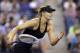 Maria Sharapova, of Russia, runs after a shot by Sabine Lisicki, of Germany, during the third round of the U.S. Open tennis tournament Friday, Aug. 29, 2014, in New York. (AP Photo/Darron Cummings)