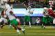 Oregon quarterback Marcus Mariota (8) throws the football resulting in a touchdown during the first quarter of an NCAA college football game against South Dakota in Eugene, Ore., Saturday, Aug. 30, 2014. (AP Photo/Ryan Kang)