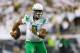 Oregon quarterback Marcus Mariota runs the football during the second quarter of an NCAA college football game against South Dakota in Eugene, Ore., Saturday, Aug. 30, 2014. (AP Photo/Ryan Kang)