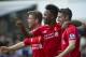Liverpool's Raheem Sterling, center, celebrates with teammates Joe Allen, right, and Alberto Moreno after scoring against Tottenham Hotspur, during their English Premier League soccer match at White Hart Lane, London, Sunday, Aug. 31, 2014 (AP Photo/Bogdan Maran)