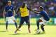 LEICESTER, ENGLAND - AUGUST 31: Yaya Sanogo of Arsenal is challenged by Liam Moore of Leicester City during the Barclays Premier League match between Leicester City and Arsenal at The King Power Stadium on August 31, 2014 in Leicester, England. (Photo by Laurence Griffiths/Getty Images)
