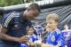 COMMERCIAL IMAGE - Chelsea FC footballer Nathaniel Chalobah signs an autograph for Josh Chansky, 11, of Mercer Island, Wash., before he Samsung-Chelsea FC Youth Football Camp at Starfire Sports Complex on Tuesday July 17, 2012 near Seattle. (Photo by Stephen Brashear/Invision for Samsung Electronics America/AP Images)