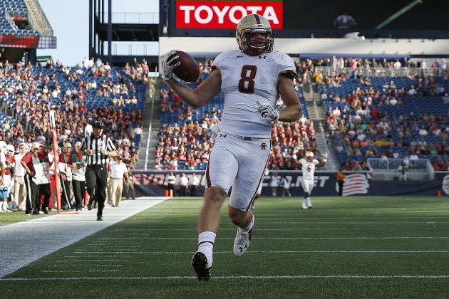 Boston College wide receiver Josh Bordner (8) scores on a touchdown pass during the fourth quarter of an NCAA college football game against Massachusetts in Foxborough, Mass., Saturday, Aug. 30, 2014. Boston College won 30-7. (AP Photo/Michael Dwyer)