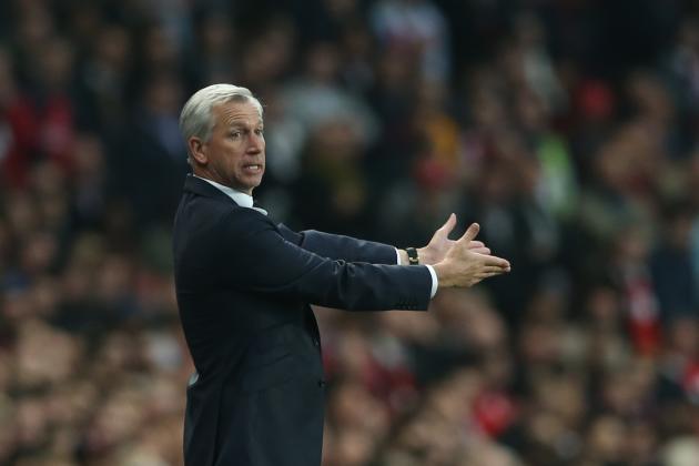 Newcastle United's manager Alan Pardew gestures to his players during their English Premier League soccer match between Arsenal and Newcastle United at the Emirates stadium in London, Monday, April  28,  2014. (AP Photo/Alastair Grant)