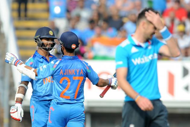 India's Shikhar Dhawan, left, celebrates with Ajinkya Rahane after scoring half century during the fourth One Day International match between England and India at Edgbaston cricket ground, Birmingham, England, Tuesday, Sept 2, 2014. (AP Photo/Rui Vieira)