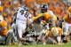Aug 31, 2014; Knoxville, TN, USA; Tennessee Volunteers running back Marlin Lane (15) rushes against Utah State Aggies safety Frankie Sutera (46) during the second half at Neyland Stadium. Tennessee won 38-7. Mandatory Credit: Jim Brown-USA TODAY Sports