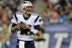 New England Patriots quarterback Tom Brady looks for a receiver against the Carolina Panthers defense in the first half of an NFL preseason football game Friday, Aug. 22, 2014, in Foxborough, Mass. (AP Photo/Charles Krupa)