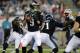 Philadelphia Eagles quarterback Nick Foles (9) looks for a pass receiver against the New England Patriots in the first half of an NFL preseason football game Friday, Aug. 15, 2014, in Foxborough, Mass. (AP Photo/Charles Krupa)