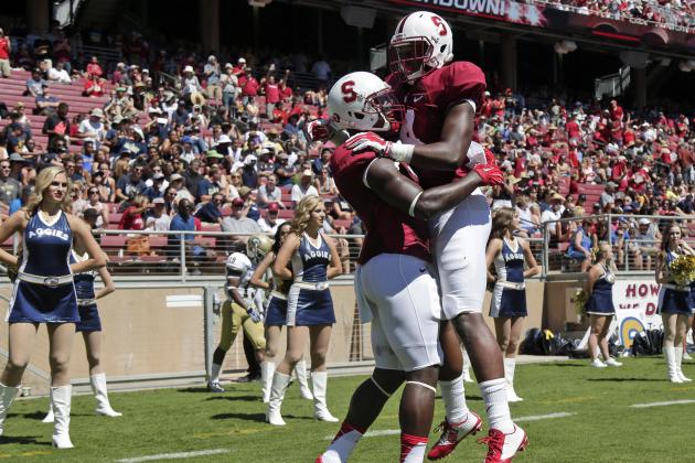 Stanford wide receiver Ty Montgomery, left, celebrates his touchdown reception with teammate Francis Owusu during the first half of an NCAA college football game against UC Davis on Saturday, Aug. 30, 2014, in Stanford , Calif. (AP Photo/Marcio Jose Sanchez)