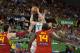 Brazil's Marcelinho Huertas, top, shoots over Spain's Pau Gasol, left, Serge Ibaka, no. 14, and Sergio Rodriguez, right, during the Group A Basketball World Cup match between Brazil and Spain in Granada, Spain, Monday, Sept. 1, 2014. The 2014 Basketball World Cup competition will take place in various cities in Spain from Aug. 30 through to Sept. 14. (AP Photo/Daniel Tejedor)