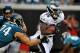 Philadelphia Eagles running back LeSean McCoy (25) eludes a tackle by Jacksonville Jaguars defensive end Aaron Kampman (74) in the third quarter of an NFL football game in Jacksonville, Fla., Sunday, Sept. 26, 2010. Philadelphia beat Jacksonville 28-3. (AP Photo/Stephen Morton)