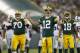 Green Bay Packers quarterback Aaron Rodgers reacts to a call during the first half of an NFL preseason football game against the Oakland Raiders Friday, Aug. 22, 2014, in Green Bay, Wis. (AP Photo/Mike Roemer)