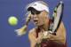 Caroline Wozniacki, of Denmark, returns to Sara Errani, of Italy, during the quarterfinal round of the 2014 U.S. Open tennis tournament, Tuesday, Sept. 2, 2014, in New York. (AP Photo/Charles Krupa)