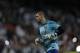 FC Barcelona's goalkeeper Victor Valdes warms up before a Spanish La Liga soccer match against Real Madrid at the Santiago Bernabeu stadium in Madrid, Sunday March 23, 2014. (AP Photo/Paul White)