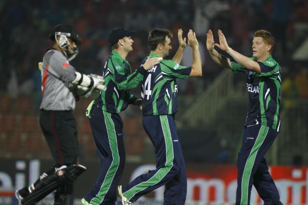 Ireland's Tim Murtagh, second right, celebrates with his teammates the wicket of United Arab Emirates's captain Khurram Khan, left, during their ICC Twenty20 Cricket World Cup match in Sylhet, Bangladesh, Wednesday, March 19, 2014. (AP Photo/A.M. Ahad)