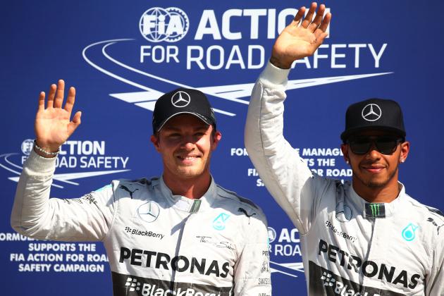 MONZA, ITALY - SEPTEMBER 06: (L-R) The top two qualifying drivers, Nico Rosberg (2nd) of Germany and Mercedes GP and Lewis Hamilton (Pole) of Great Britain and Mercedes GP pose for the cameras following Qualifying ahead of the F1 Grand Prix of Italy at Autodromo di Monza on September 6, 2014 in Monza, Italy. (Photo by Mark Thompson/Getty Images)