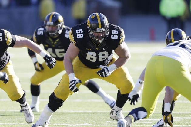 Iowa offensive lineman Brandon Scherff (68) looks to make a block during the second half of an NCAA college football game against Michigan, Saturday, Nov. 23, 2013, in Iowa City, Iowa. Iowa won 24-21. (AP Photo/Charlie Neibergall)