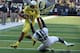 EUGENE, OR -SEPTEMBER 06; Quarterback Marcus Mariota #8 of the Oregon Ducks is brought down by safety RJ Williamson #26 of the Michigan State Spartans in the first quarter of the game at Autzen Stadium on September 6, 2014 in Eugene, Oregon. (Photo by Steve Dykes/Getty Images)