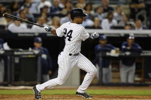 New York Yankees' Chris Young follows through on a fifth-inning RBI single in a baseball game against the Tampa Bay Rays at Yankee Stadium in New York, Tuesday, Sept. 9, 2014. (AP Photo/Kathy Willens)
