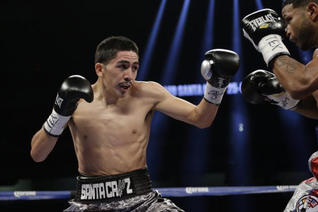 Leo Santa Cruz, left, and Cesar Seda, right, trade hits during their WBC super bantamweight title fight, Saturday, Dec. 14, 2013, in San Antonio. (AP Photo/Eric Gay)