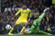 Chelsea's Diego Costa, left, is thwarted by Everton's goalkeeper Tim Howard during their English Premier League soccer match at Goodison Park Stadium, Liverpool, England, Saturday Aug. 30, 2014. (AP Photo/Jon Super)