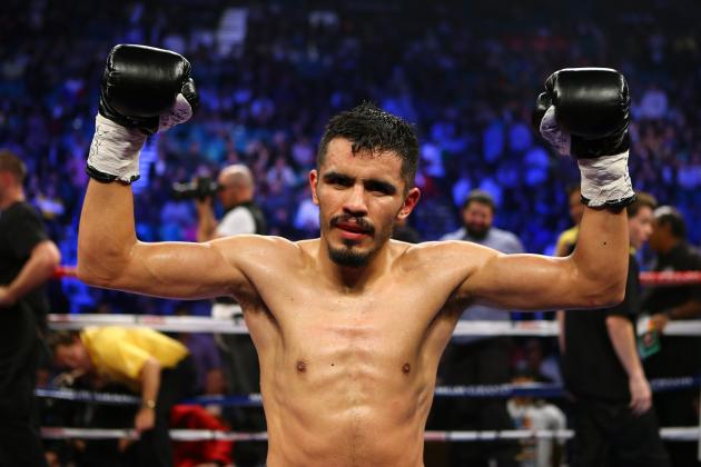 LAS VEGAS, NV - DECEMBER 08: (L-R) Miguel Angel Vazquez celebrates after the 12th round against Mercito Gesta after their IBF world lightweight title fight at the MGM Grand Garden Arena on December 8, 2012 in Las Vegas, Nevada. Vazquez defeated Gesta by unanimous decision. (Photo by Al Bello/Getty Images)