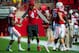 LINCOLN, NE - SEPTEMPER 6: Defensive end Randy Gregory #4 of the Nebraska Cornhuskers greets teammates during their game against the McNeese State Cowboys at Memorial Stadium on September 6, 2014 in Lincoln, Nebraska. Gregory missed the game due to injury. (Photo by Eric Francis/Getty Images)