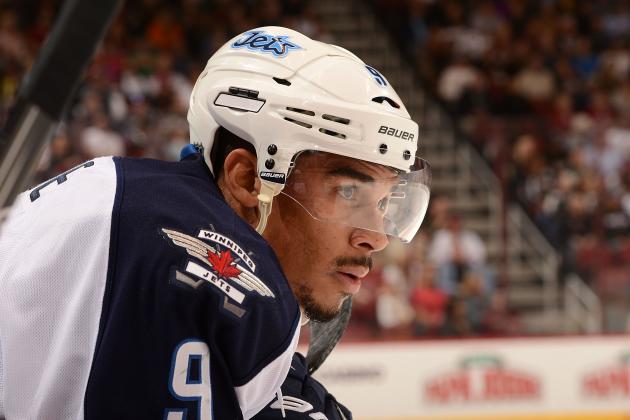 GLENDALE, AZ - APRIL 01: Evander Kane #9 of the Winnipeg Jets looks up ice from the bench during a stop in play against the Phoenix Coyotes at Jobing.com Arena on April 1, 2014 in Glendale, Arizona. (Photo by Norm Hall/NHLI via Getty Images)