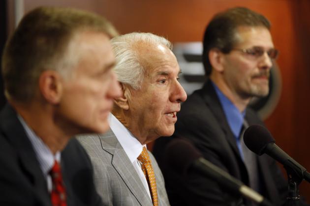 Philadelphia Flyers chairman Ed Snider, center, answers a reporter's question during an NHL hockey news conference with new general manager Ron Hextall, right, and new president Paul Holmgren, Wednesday, May 7, 2014, in Philadelphia. (AP Photo/Matt Slocum)