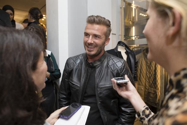 David Beckham is interviewed as he promotes the Beckham for Belstaff collection during Fashion Week, Tuesday, Sept. 9, 2014, in New York. (AP Photo/John Minchillo)