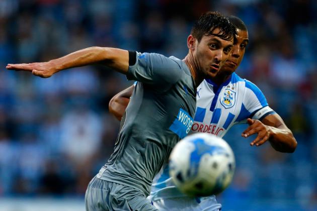 HUDDERSFIELD, ENGLAND - AUGUST 5: Lee Peltier (R) of Huddersfield in action with Facundo Ferreyra of Newcastle during the Pre Season Friendly match between Huddersfield Town and Newcastle United at the John Smith's Stadium on August 5, 2014 in Huddersfield, England. (Photo by Paul Thomas/Getty Images)